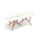 American made modern dining table featuring a white sintered stone top and unique wood crisscross legs, inspired by Copeland Furniture’s Baton table.