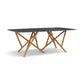 Baton Sintered Stone Top Table by Copeland Furniture with bold black top and geometric wood legs, American made for a modern dining space.