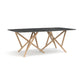 Baton Sintered Stone Boat Top Table by Copeland Furniture with a black marble top and geometric light wood legs, American made artisan craftsmanship.