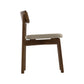 Copeland Furniture Baton Chair shown from the side, highlighting its beige cushioned seat and elegant curved backrest.