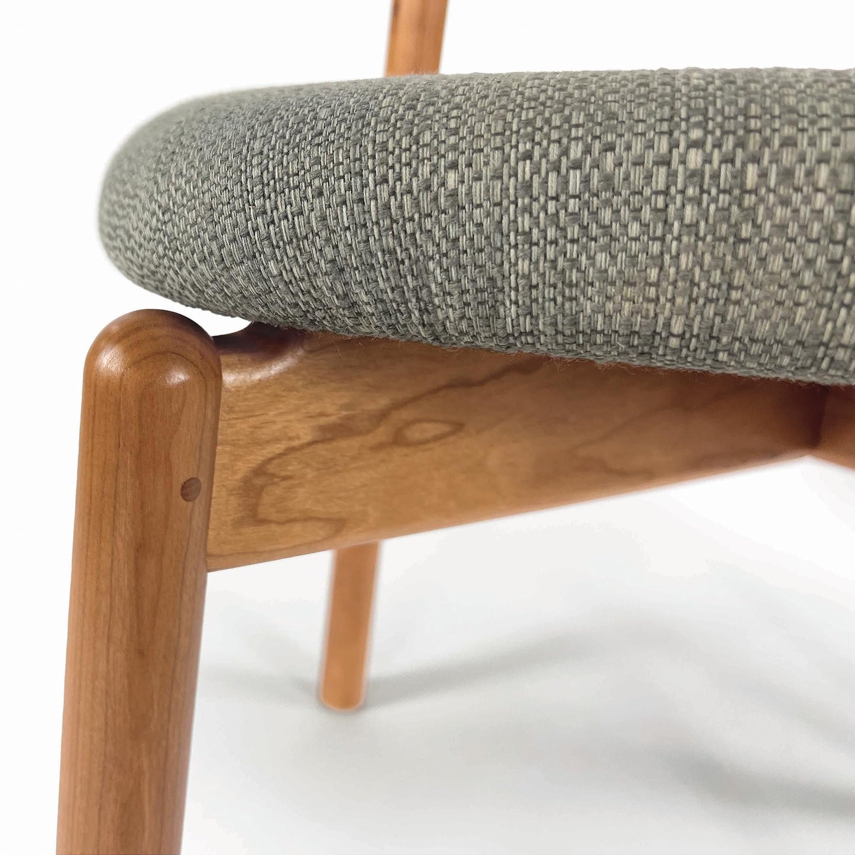 Baton Chair by Copeland Furniture with textured gray fabric seat and sleek light wood frame, fine American craftsmanship highlighted.