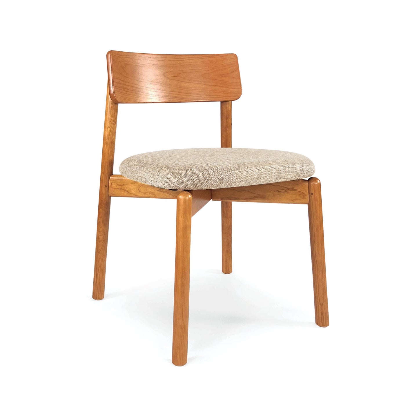 Baton Chair by Copeland Furniture with a light brown frame, elegant curved wood back, and comfortable beige padded seat; American made craftsmanship.