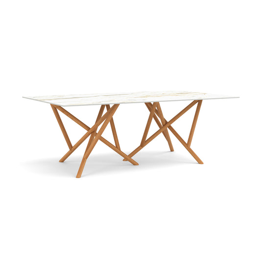 Baton Sintered Stone Top Table by Copeland Furniture with a sleek stone top and bold geometric wooden legs, crafted in America.
