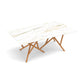 Baton Sintered Stone Top Table by Copeland Furniture with a white marble-patterned top and distinctive crisscross solid wood legs, American made.