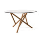 Baton Round Glass Top Table by Copeland Furniture with angled wooden legs in a bold geometric design, handcrafted in Vermont from premium American wood.
