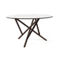 Baton Round Glass Top Table by Copeland Furniture with elegant intersecting angled wooden legs, showcasing American made craftsmanship.