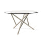 Baton Round Glass Top Table by Copeland Furniture with a striking natural wood base and intersecting geometric legs, American made craftsmanship.