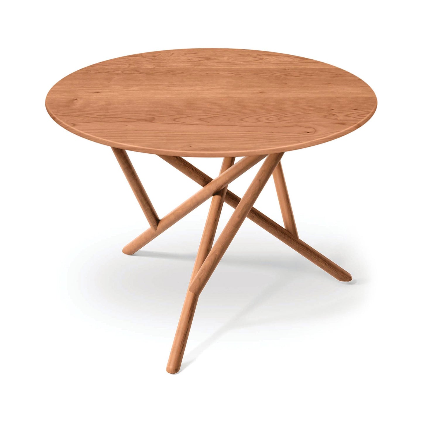 Baton Round Solid Top Dining Table by Copeland Furniture with a smooth solid wood top and intersecting legs, crafted in America.
