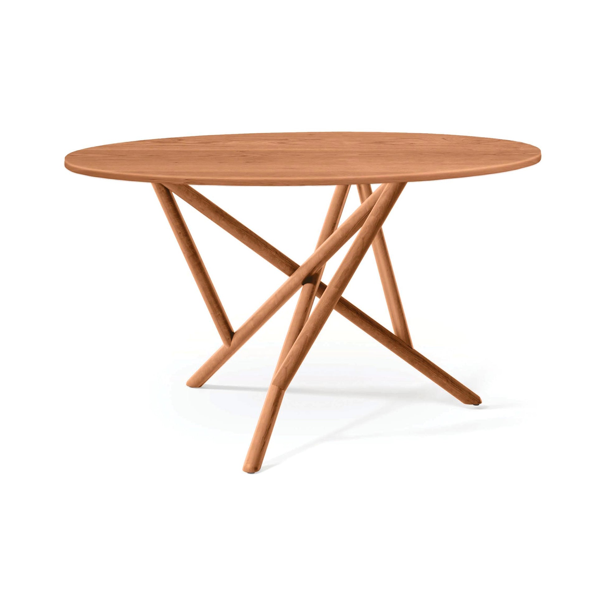 Copeland Baton Round Solid Top Dining Table with a smooth round top and modern intersecting angled legs, expertly crafted from solid wood.