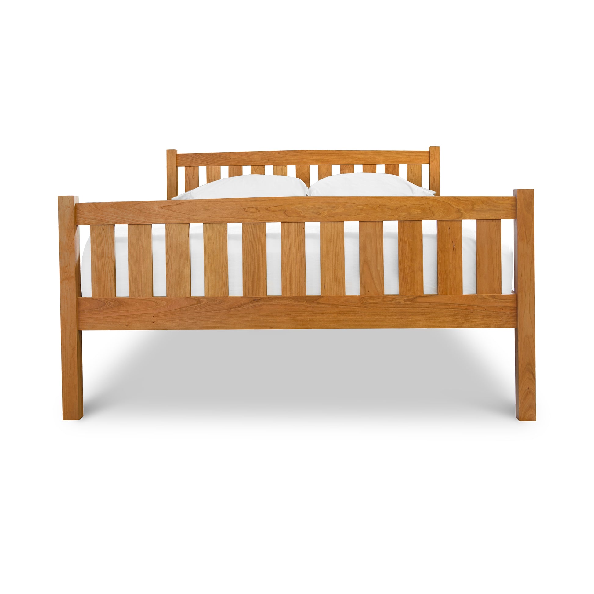 Bennington Bed with High Footboard from the Vermont Furniture Designs Collection with a simple headboard and a white mattress, isolated on a white background.