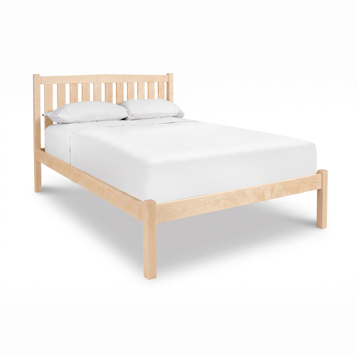 Bennington Bed with Low Footboard by Vermont Furniture Designs featuring a crisp white mattress and pillows, crafted in solid wood.
