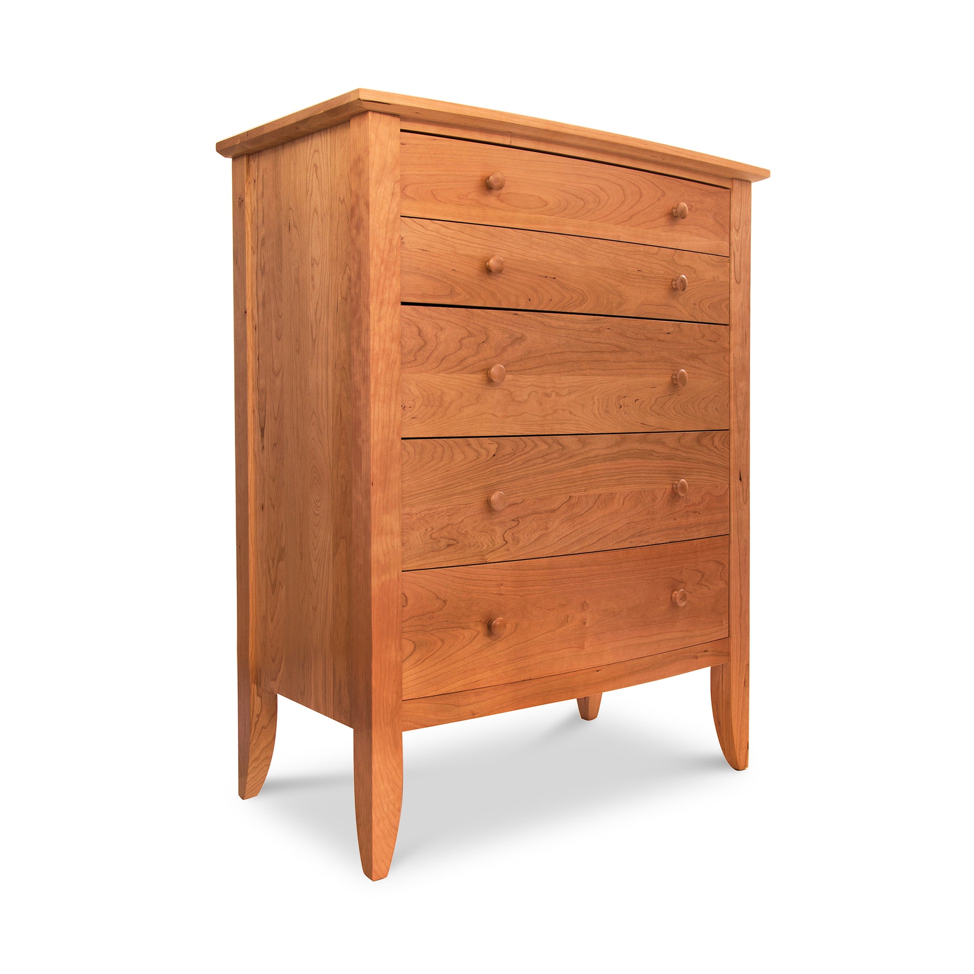 A handmade, Lyndon Furniture Bow Front 5-Drawer Chest made from hardwoods on a white background.