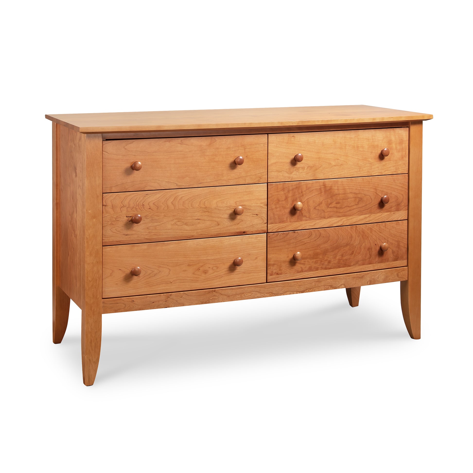 Handcrafted Bow Front 6-Drawer Dresser by Lyndon Furniture in solid wood. Features six spacious drawers, round wooden knobs, and tapered legs. This American-made dresser is perfect for bedroom or living room decor. Made in Vermont with light brown wood.