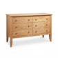 Bow Front 6-Drawer Dresser by Lyndon Furniture with round wooden knobs and tapered legs, crafted in the USA from solid wood.