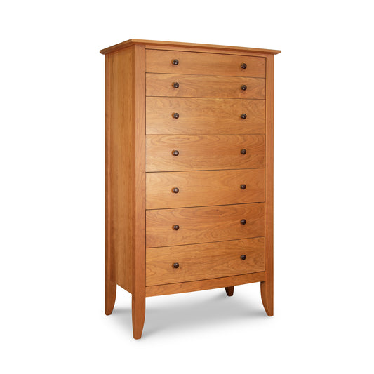 A wooden chest of drawers on a white background.