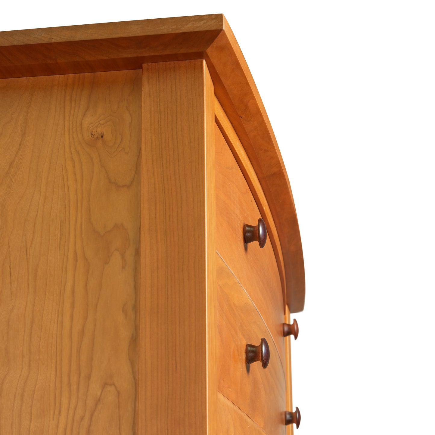 A close up of a wooden chest of drawers.