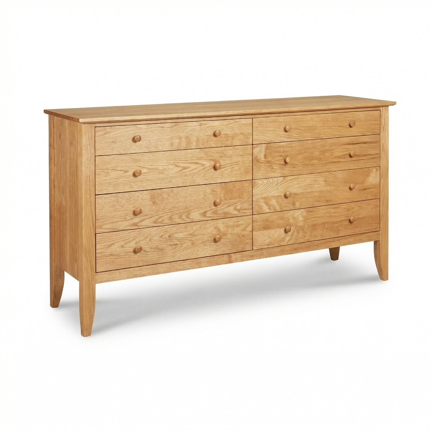 The Bow Front 8-Drawer Dresser by Lyndon Furniture with round wooden knobs, crafted in Vermont from solid wood, highlighting its elegant curved front.