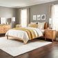 Lyndon Furniture Classic Wood Bed with matching nightstand and dresser, showcasing premium American-made craftsmanship in bedroom furniture.