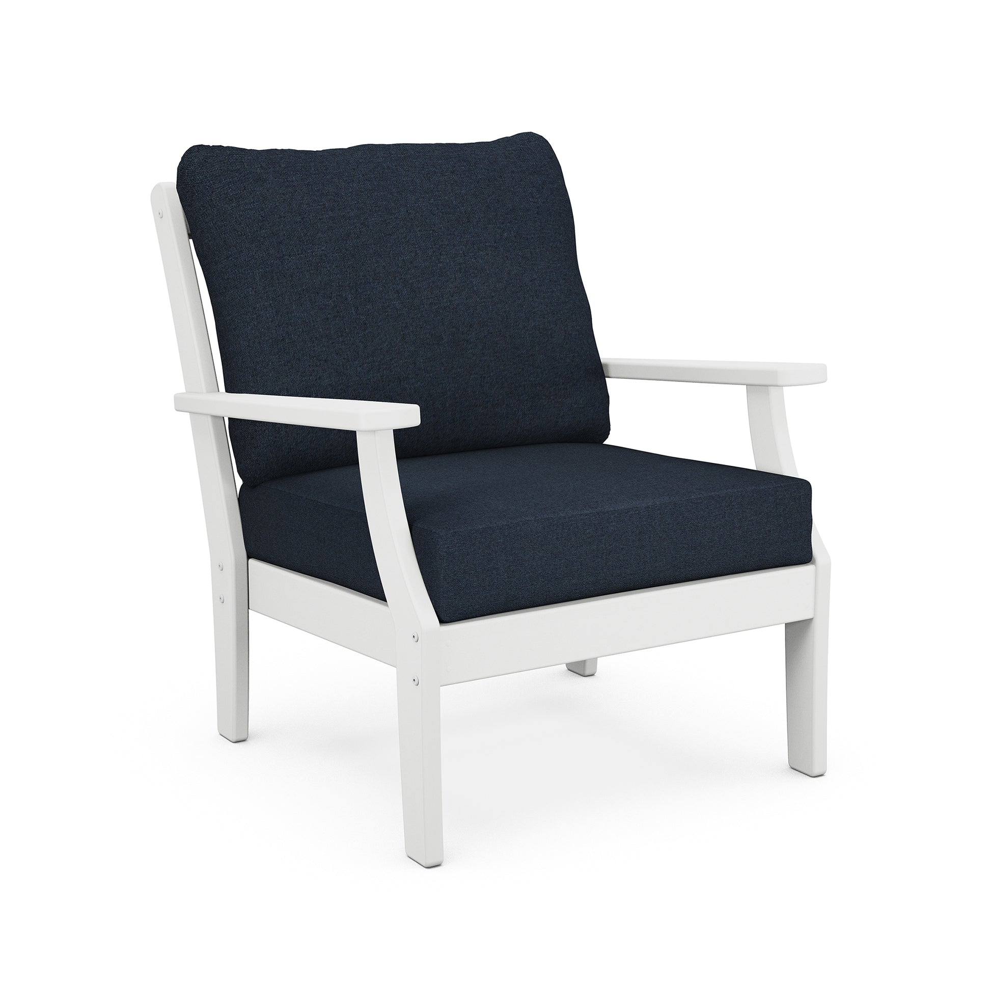 A modern POLYWOOD® Braxton Deep Seating Chair with a white frame and deep blue cushions on a white background. the chair design is simple, featuring broad armrests and a straight