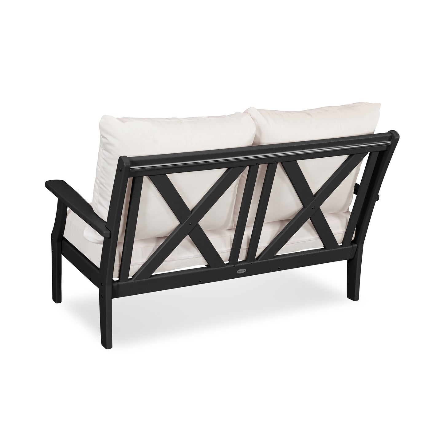 Sentence with replaced product: Black POLYWOOD® Braxton Deep Seating Settee frame with a criss-cross design on the sides, paired with white cushions, isolated on a white background.