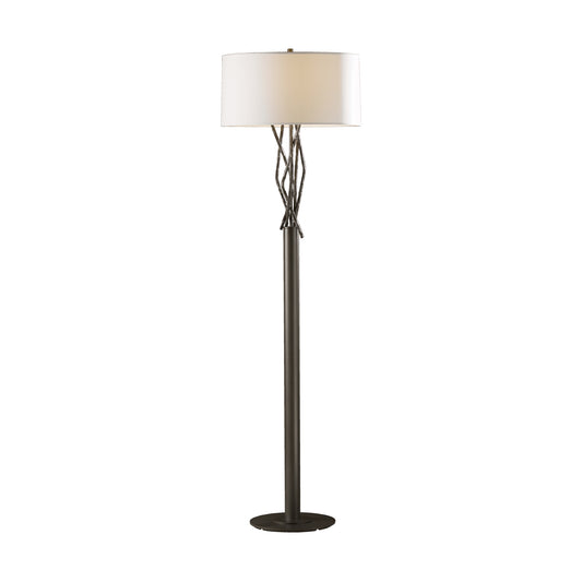 The Hubbardton Forge Brindille floor lamp features a sleek design and a white shade.
