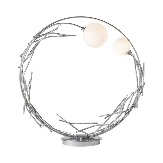 Brindille Ring Lamp by Hubbardton Forge showcases elegant metal branches and two white globes on a sleek silver frame, perfect for modern interiors.