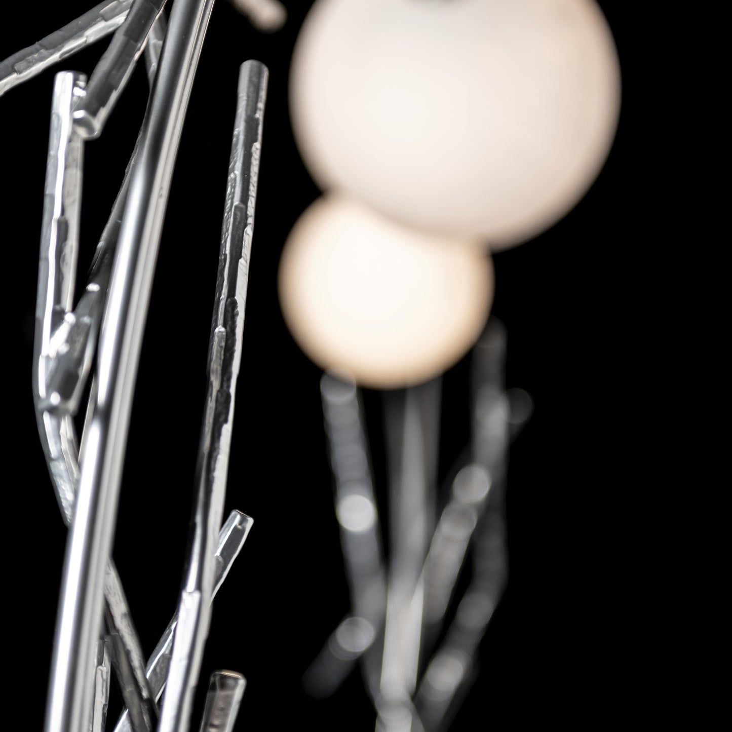 Brindille Ring Lamp by Hubbardton Forge featuring artisan-crafted metallic rods inspired by birch trees, highlighting fine American-made craftsmanship.