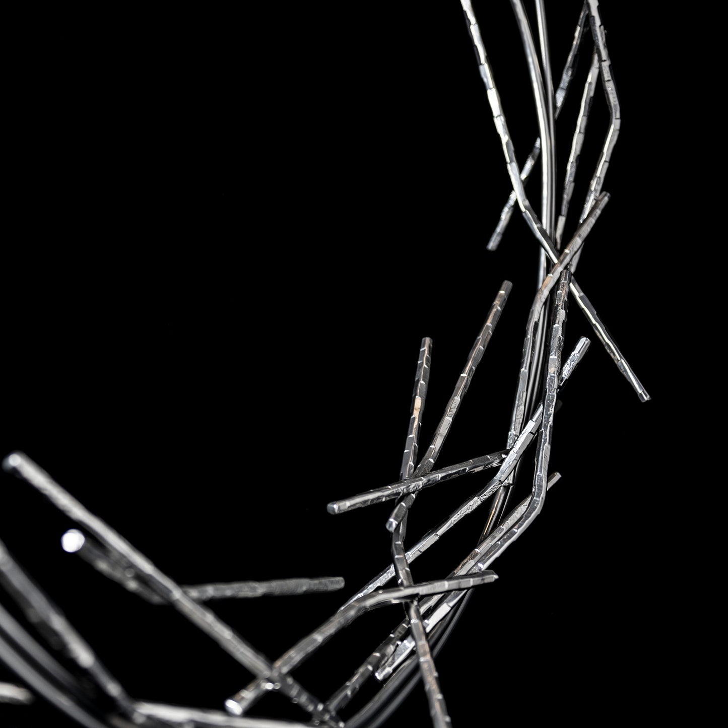 Brindille Ring Lamp by Hubbardton Forge showcases handcrafted, intertwining metallic rods in an organic ring design, crafted in Vermont.