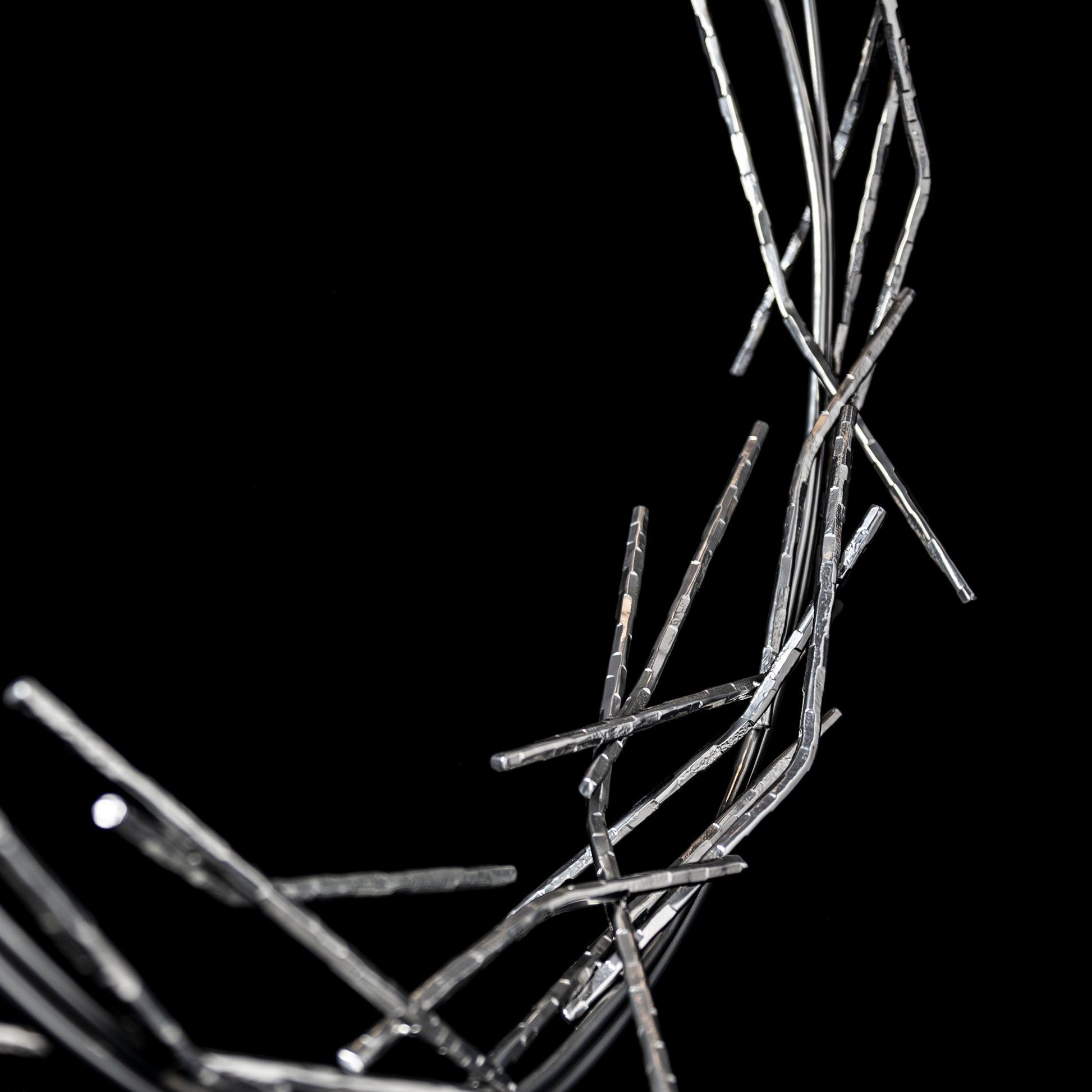 Brindille Ring Lamp by Hubbardton Forge showcases handcrafted, intertwining metallic rods in an organic ring design, crafted in Vermont.