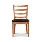 Bromley Ladder-Back Chair by Vermont Woods Studios with natural wood frame and black upholstered seat, highlighting craftsmanship and design.