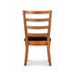 Bromley Ladder-Back Chair by Vermont Woods Studios in natural wood with black seat, back view highlights detailed craftsmanship and American design.