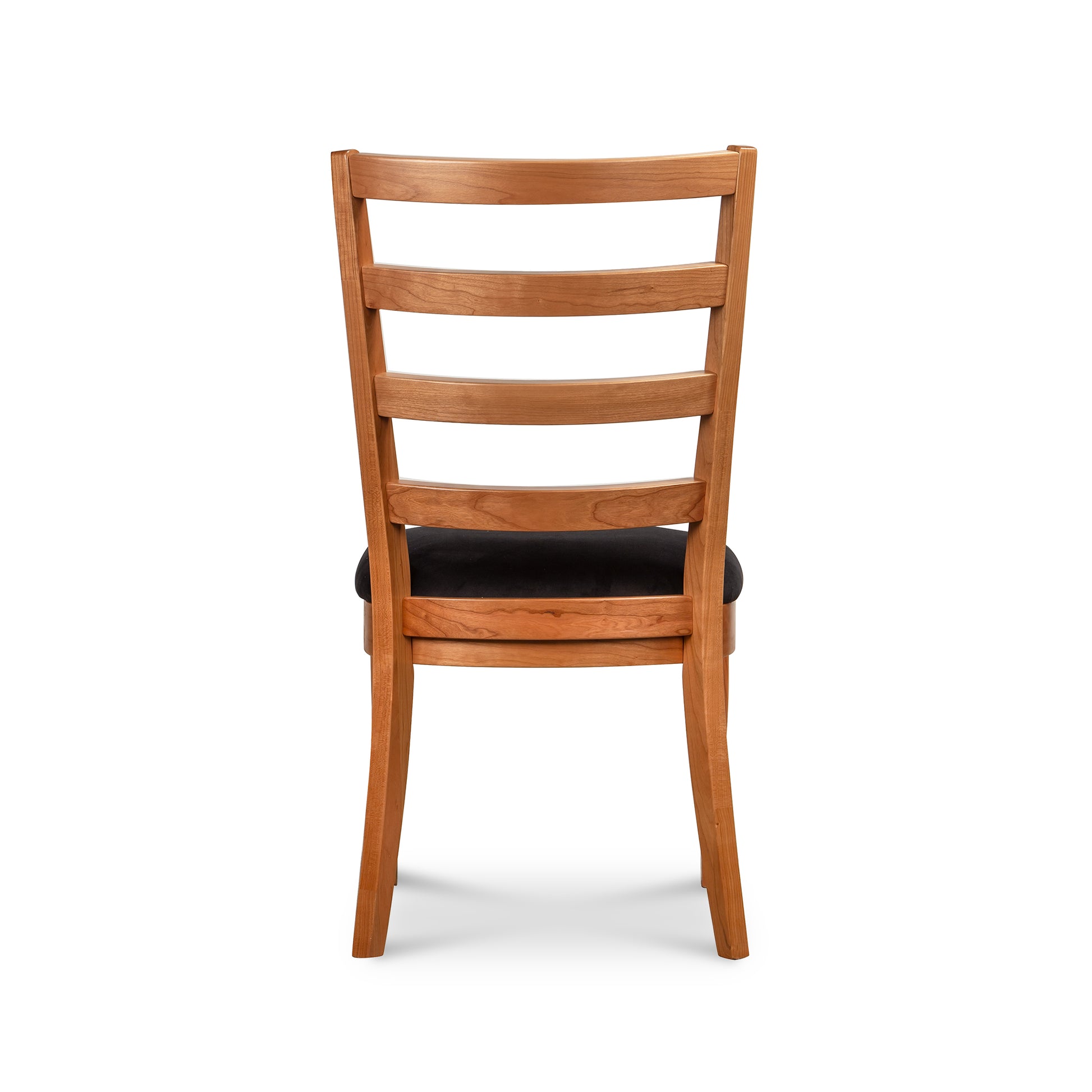 Bromley Ladder-Back Chair by Vermont Woods Studios in natural wood with black seat, back view highlights detailed craftsmanship and American design.