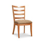 Bromley Ladder-Back Chair by Vermont Woods Studios with cushioned brown seat and natural wood frame, showcasing quality American craftsmanship.