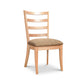Bromley Ladder-Back Chair by Vermont Woods Studios, crafted from natural wood with a brown upholstered seat. American made, high quality craftsmanship.