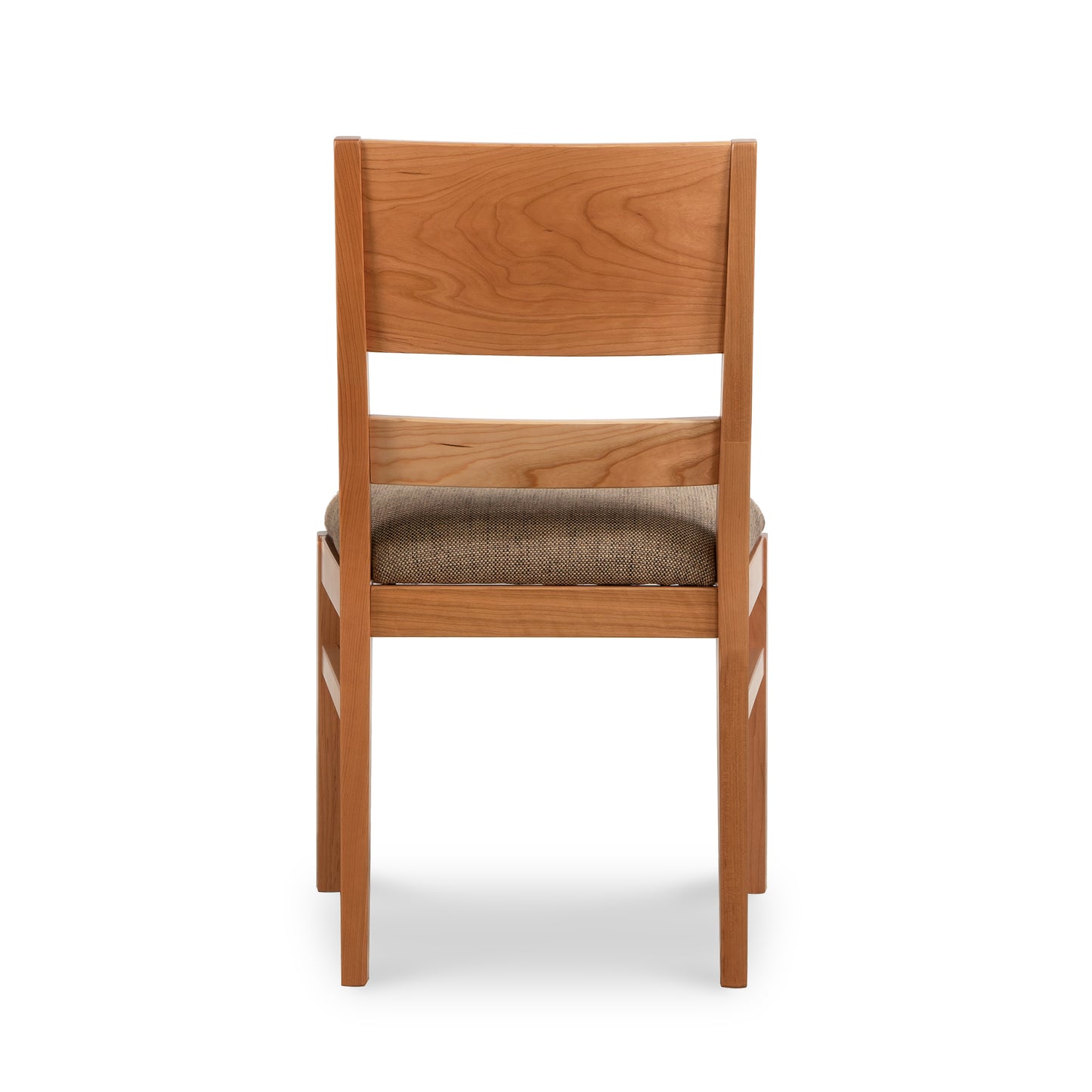 A wooden dining chair with a tan seat.