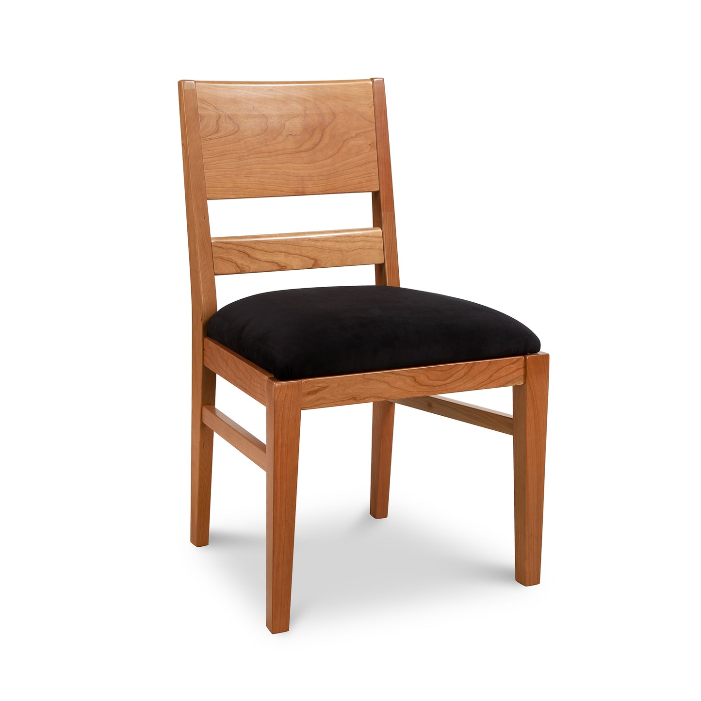 A wooden dining chair with black upholstered seat.