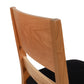 A wooden chair with black seat and back.