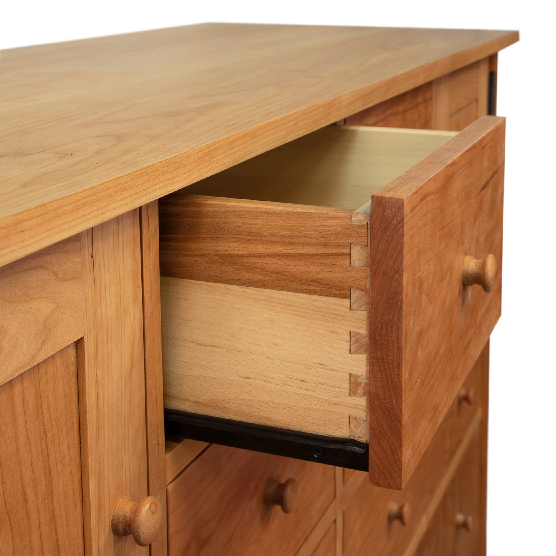 Burlington Shaker 8-Drawer Dresser showcasing dovetail joints and wooden knobs, highlighting Vermont craftsmanship.