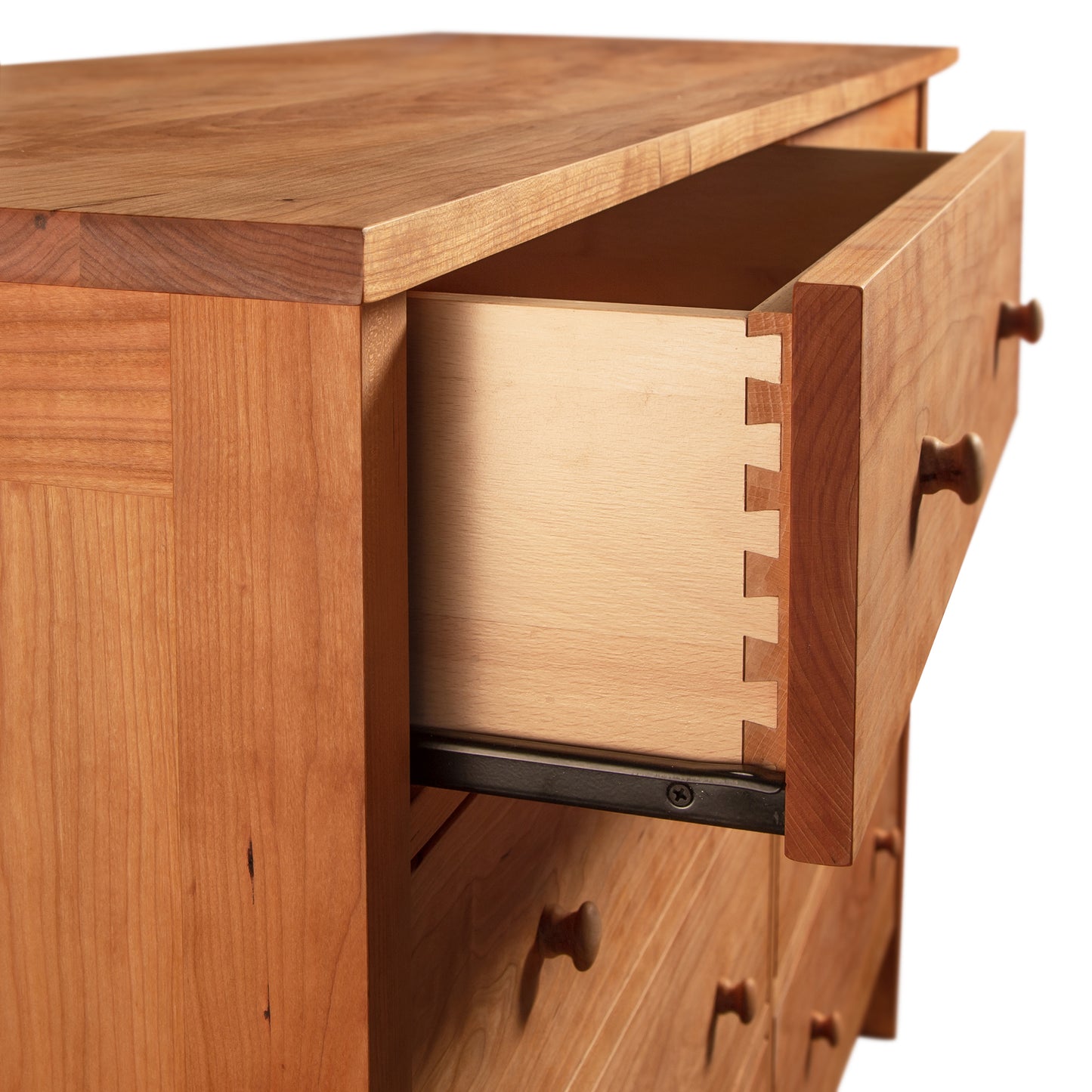 Luxury bedroom furniture: Burlington Shaker 8-Drawer Dresser #1 with one drawer partially open, revealing dovetail joint construction as part of the Vermont Furniture Designs collection.