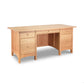 Burlington Shaker Executive Desk by Vermont Furniture Designs, with three drawers on one side and a cabinet on the other, isolated on a white background.