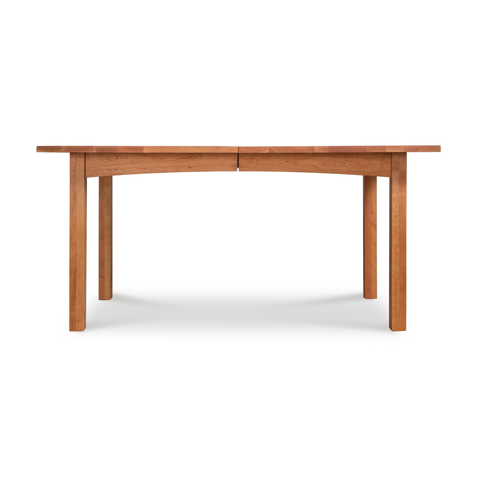 A solid woods Vermont Furniture Designs Burlington Shaker Extension Dining Table with a simple design, having four legs and a rectangular top, isolated on a white background.