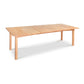 A rectangular Burlington Shaker Extension Dining Table from Vermont Furniture Designs with a smooth finish and simple design, isolated on a white background.