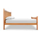 Burlington Shaker High Footboard Bed by Vermont Furniture Designs with vertical slats, hand-crafted in the USA, shown with mattress and white bedding.