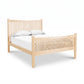 Burlington Shaker High Footboard Bed by Vermont Furniture Designs in light wood with vertical slats, shown with white bedding and two pillows.