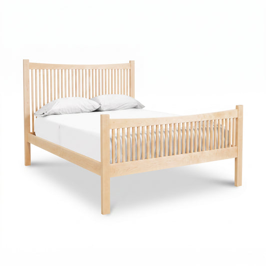 Burlington Shaker High Footboard Bed by Vermont Furniture Designs in light wood with vertical slats, shown with white bedding and two pillows.