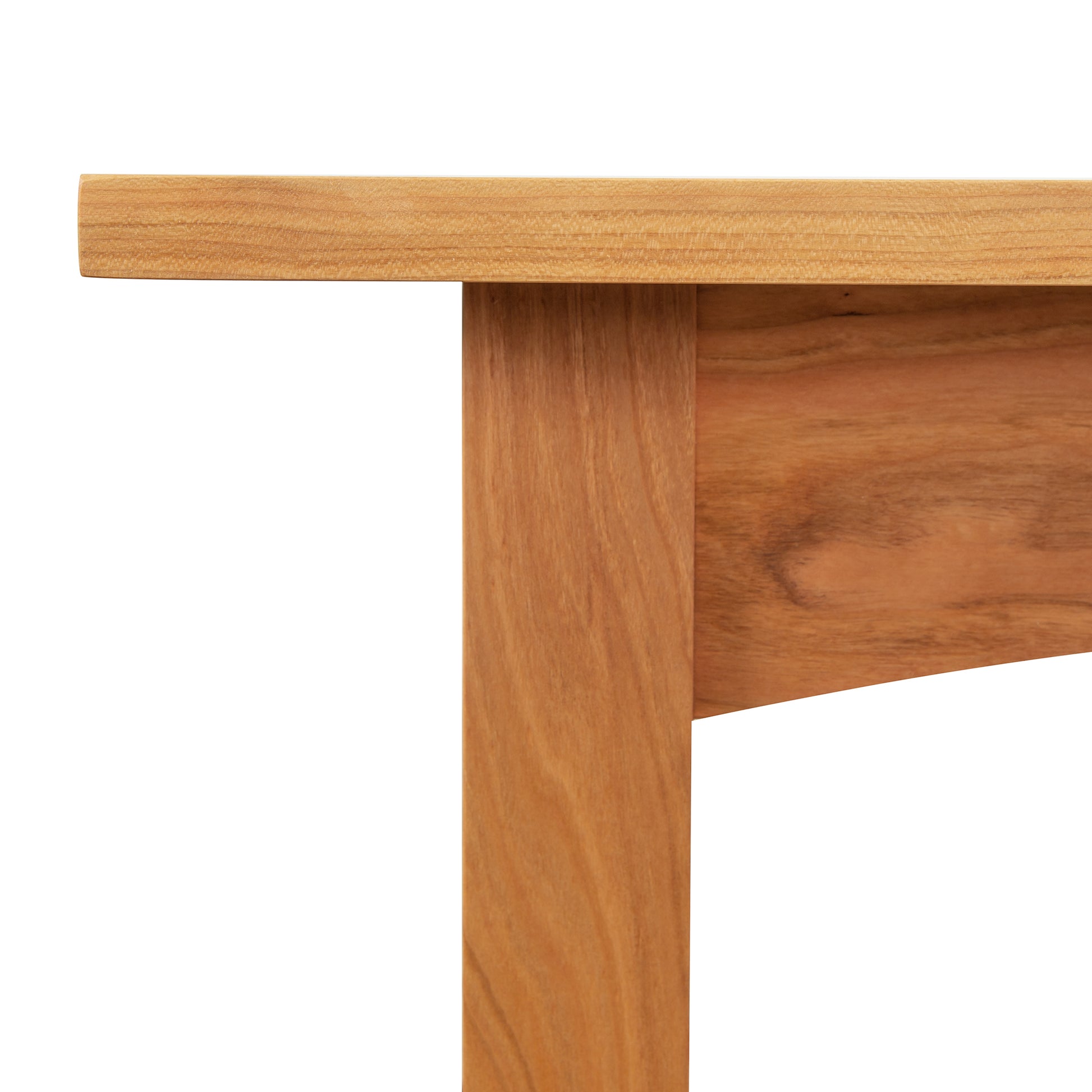 Close-up view of a Vermont Furniture Designs Burlington Shaker Lamp Table wooden table corner showing joint and grain details.