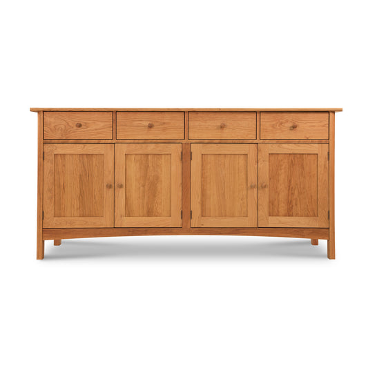 Vermont Furniture Designs Burlington Shaker Long Sideboard, made of solid wood, with three drawers and three cabinet doors, isolated on a white background.