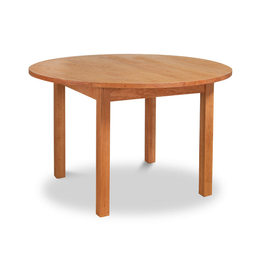 Handcrafted solid wood Vermont Furniture Designs Burlington Shaker Round Solid Top Dining Table on a white background.