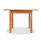 A simple Vermont Furniture Designs Burlington Shaker Round Solid Top Dining Table isolated on a white background.