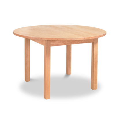 Burlington Shaker Round Solid Top Dining Table handcrafted from solid wood with four straight legs, showcasing classic American craftsmanship.